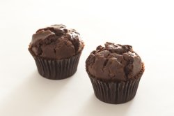 chocolate muffins on white table