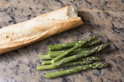Fresh green asparagus tips and bread