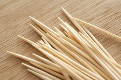 Pile of wooden toothpicks or cocktail sticks