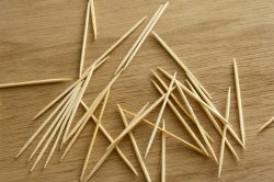 Scattered toothpicks or cocktail sticks on a table