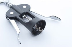 Lever style bottle opener with corkscrew