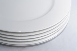 Stack of clean generic white ceramic plates