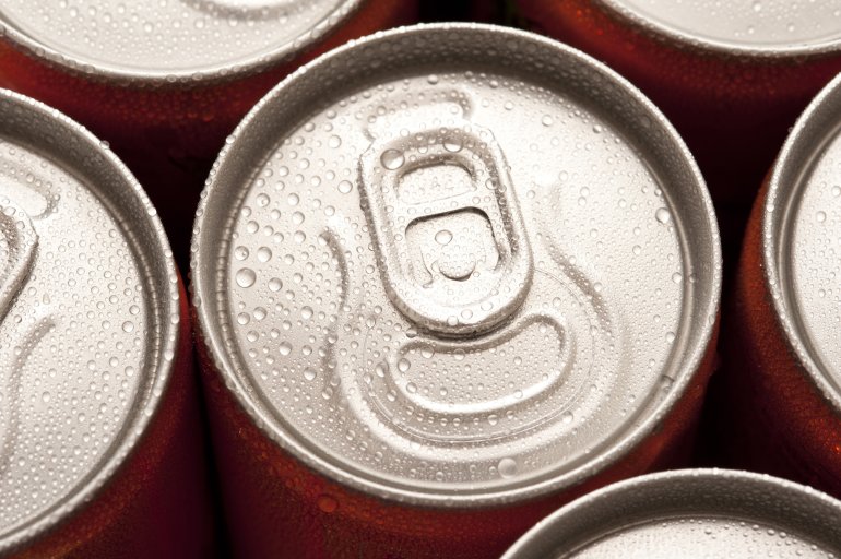 Close up view of the ring pull on a can of cold soda or soft drink with moisture condensation, high angle view of the lid of the tin