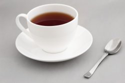 Generic white cup of hot black tea