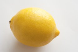 Close-up of yellow lemon on white background