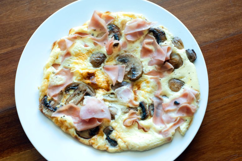 Overhead view of a delicious ham and mushroom omelette for a light healthy meal