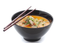 creamy soup in bowl with chopsticks