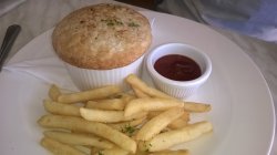 Pie and potato chips with tomato sauce