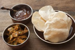 Asian curry with chutney and papadums
