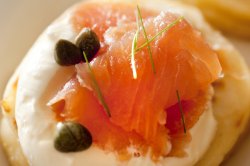 Close up on raw salmon with capers