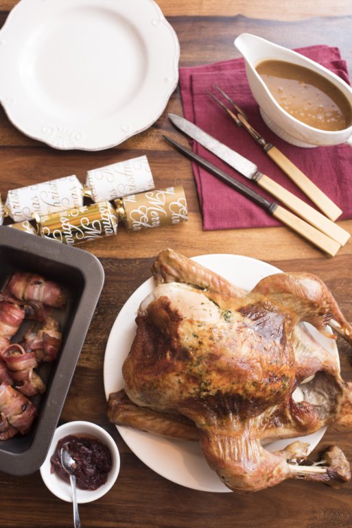 Thanksgiving turkey with side dishes served on table