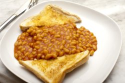 Beans and toasted bread in plate