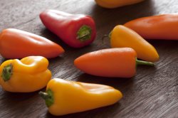 Colourful orange mini sweet peppers or capsicum