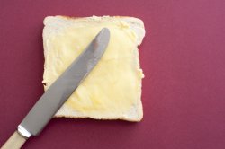 Slice of buttered fresh white bread