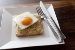 Square dish with crumpet and egg