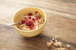 granola topped with raspberries