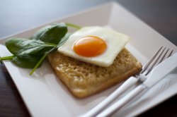 Simple fried egg with crumpet and spinach