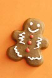 Gingerbread cookie on a festive orange background