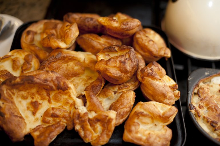 Delicious homemade yorkshire pudding as seen close up and browned at its edges