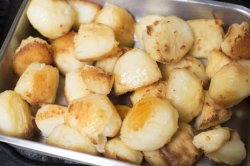 roasting tin of fresh roast potatoes