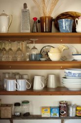 Open storage shelves in a farmhouse kitchen