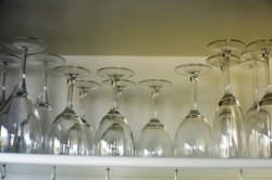 Assorted clean glassware stored on a shelf
