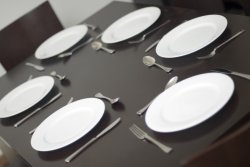 Place setting and plates on a table with no food