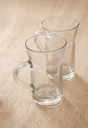 Two empty clean tea glasses with handles