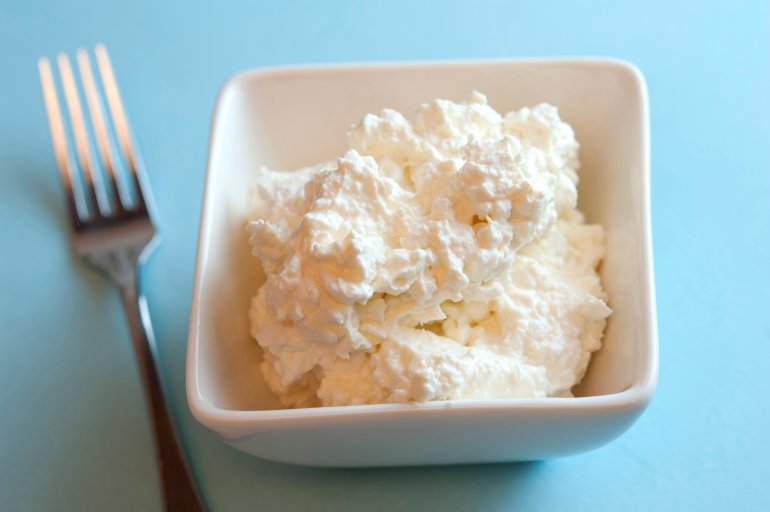 Dish of cottage cheese, or pot cheese, a traditional soft cheese made from the curds of skim milk