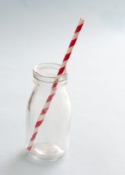 glass milk bottle with striped straw