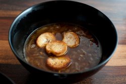 Crisp golden croutons in onion soup