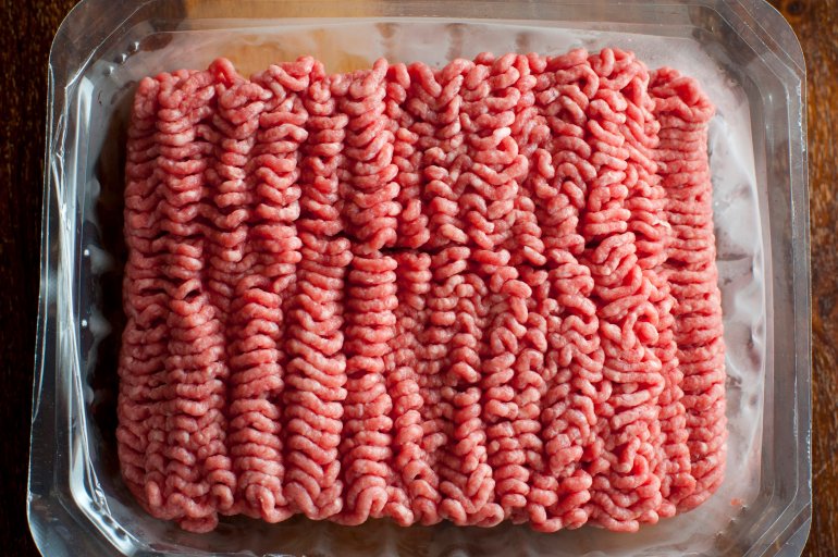 Punnet of raw beef mince arranged in lines from the mincing machine at the butchery and a healthy ingredient in everyday cooking