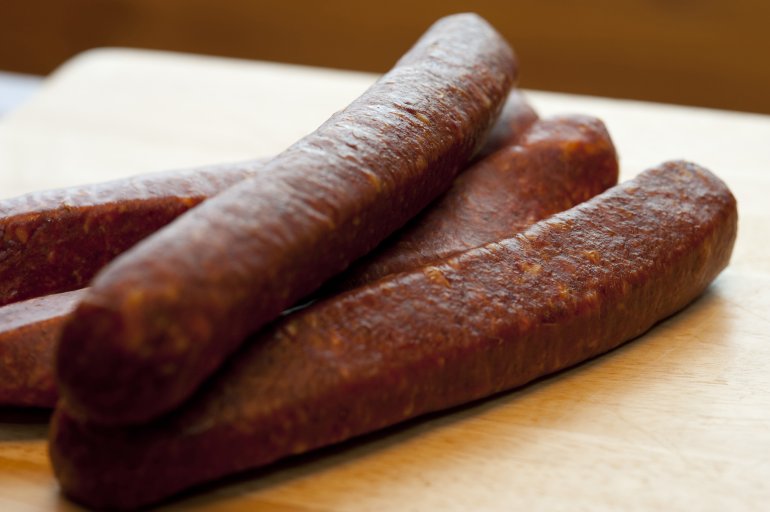 Close-up of four red sausages