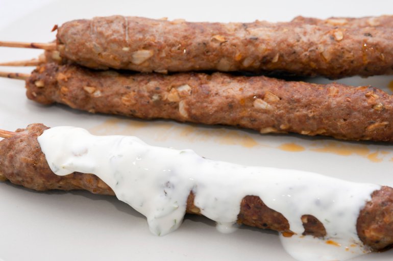 Kofta kebabs made from spiced minced lamb served with a yoghurt sauce