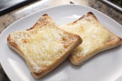 Toasted bread with melted cheese