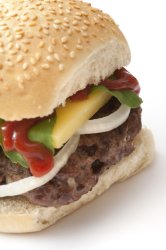 Cropped view of hamburger with sesame bun