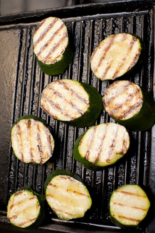 Tasty sliced grilled aubergine, eggplant or brinjal on a griddle viewed from overhead